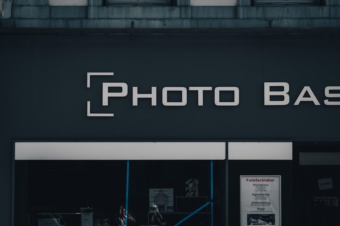 a black building with a sign that says photo bask