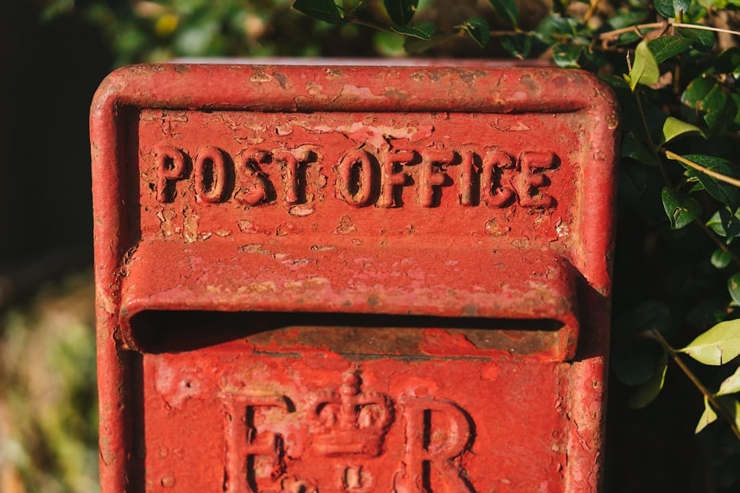 a red post box with the word post office written on it